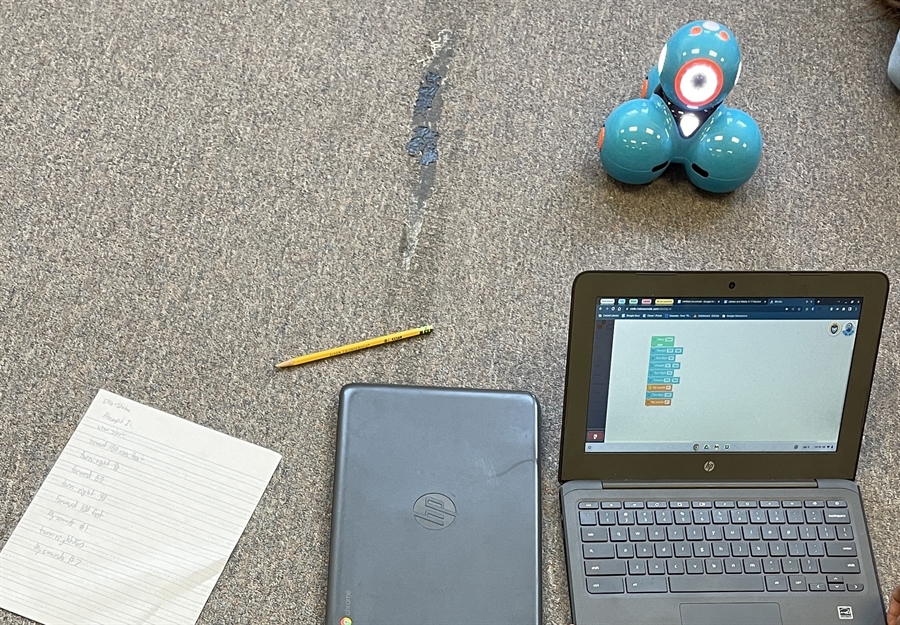 Students coding with robots Students coding with robots