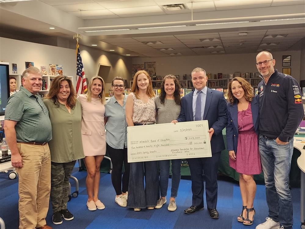  AFEE Trustees presenting a check to the Board of Education