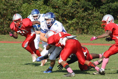 Photo of student football players mid-game