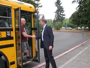 Superintendent greeting a bus driver on the first day of school 