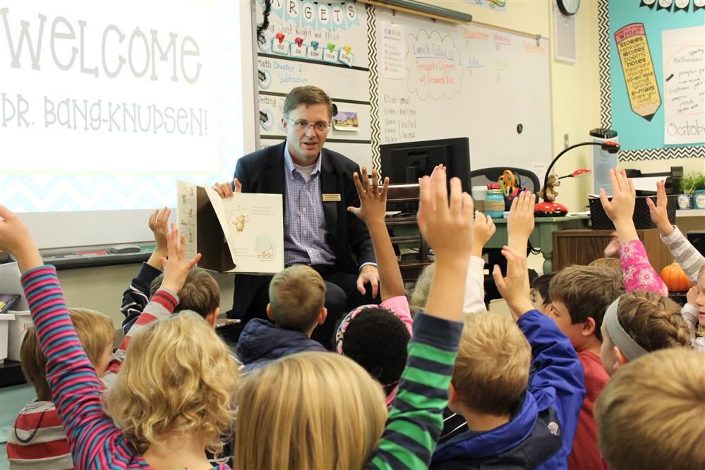 Superintendent reading to 1st graders