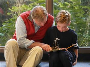 Adult and Child Reading Together 