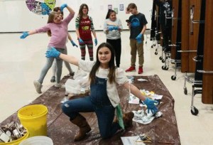 Students helping with recycling in the school caforium