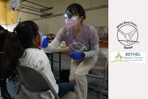 dentist looking at a child's teeth