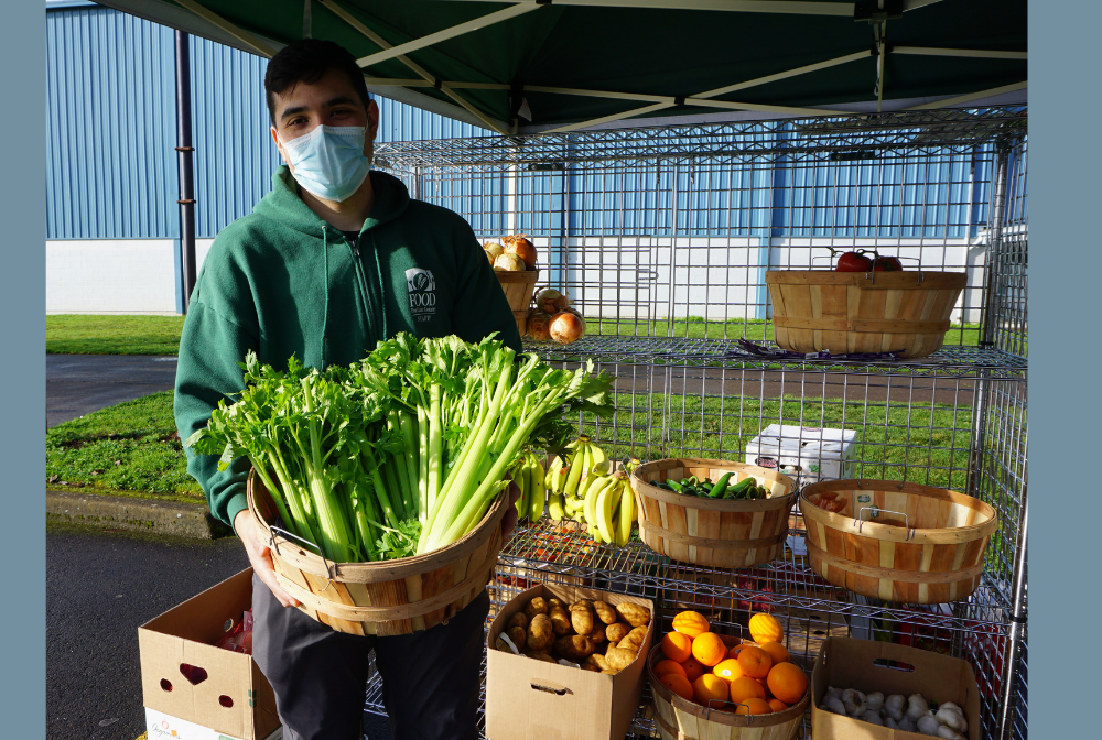 Man holding basket of celery outside of Shasta Middle School