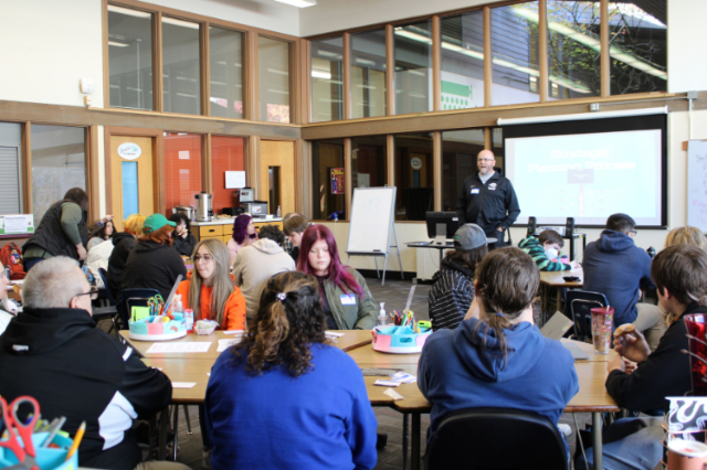 Superintendent Sproles speaking to a group of adults