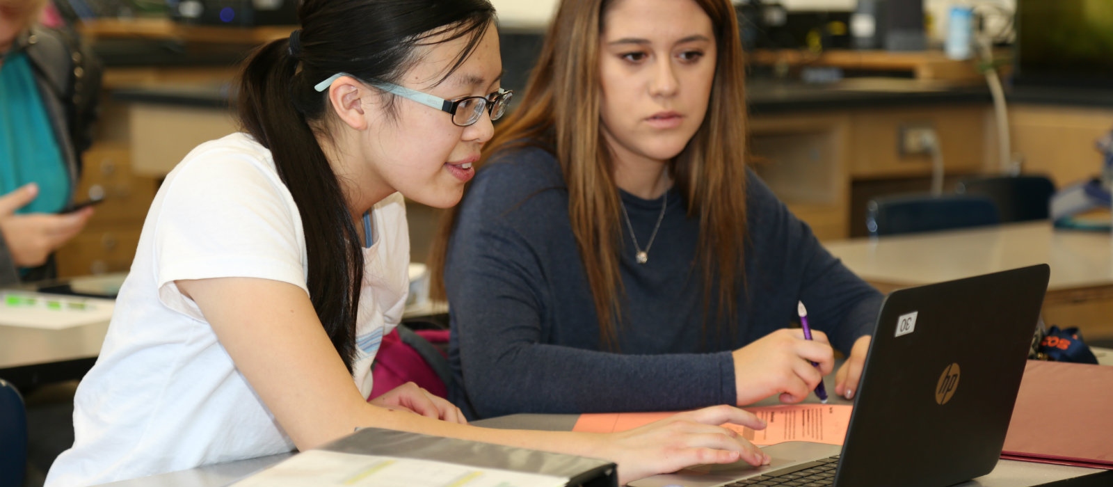 Secondary students studying on chromebooks