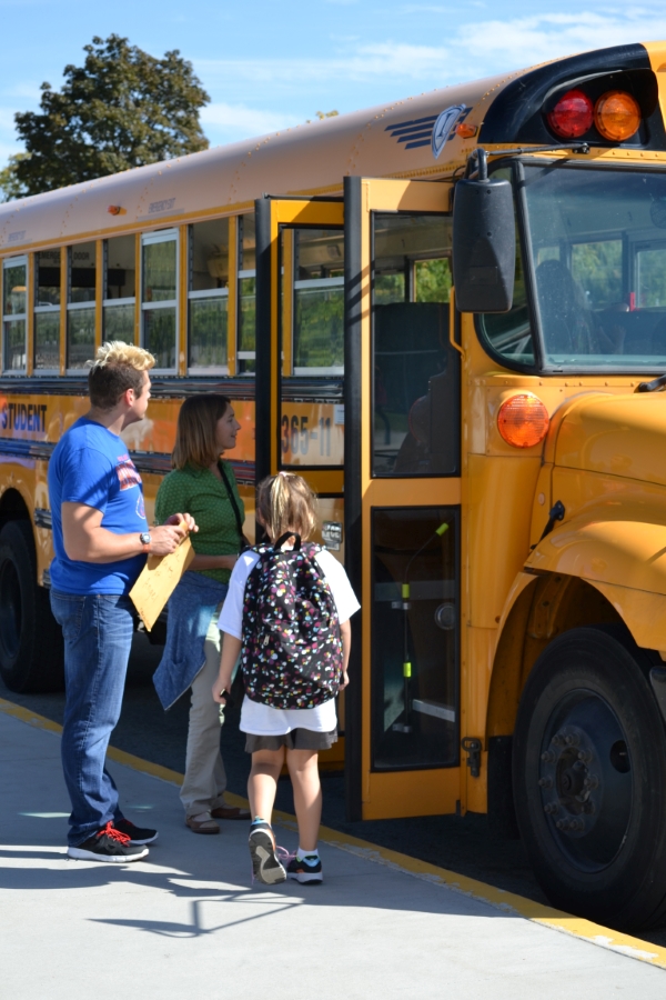 Teachers Talking to School Bus Driver at Bus Door Teachers Talking to School Bus Driver at Bus Door