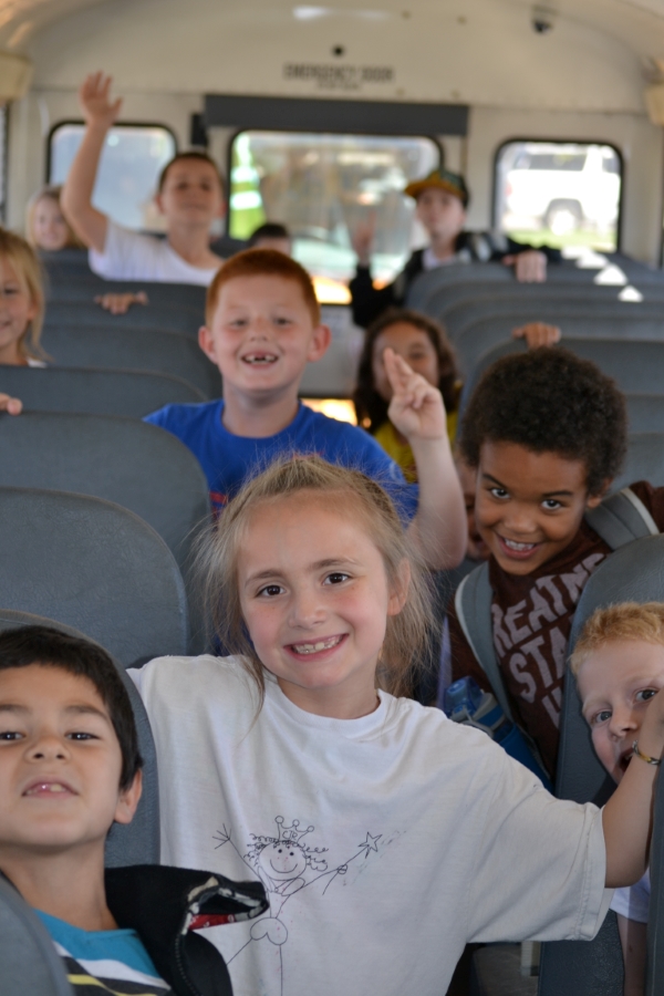Students Waving Inside School Bus Students Waving Inside School Bus