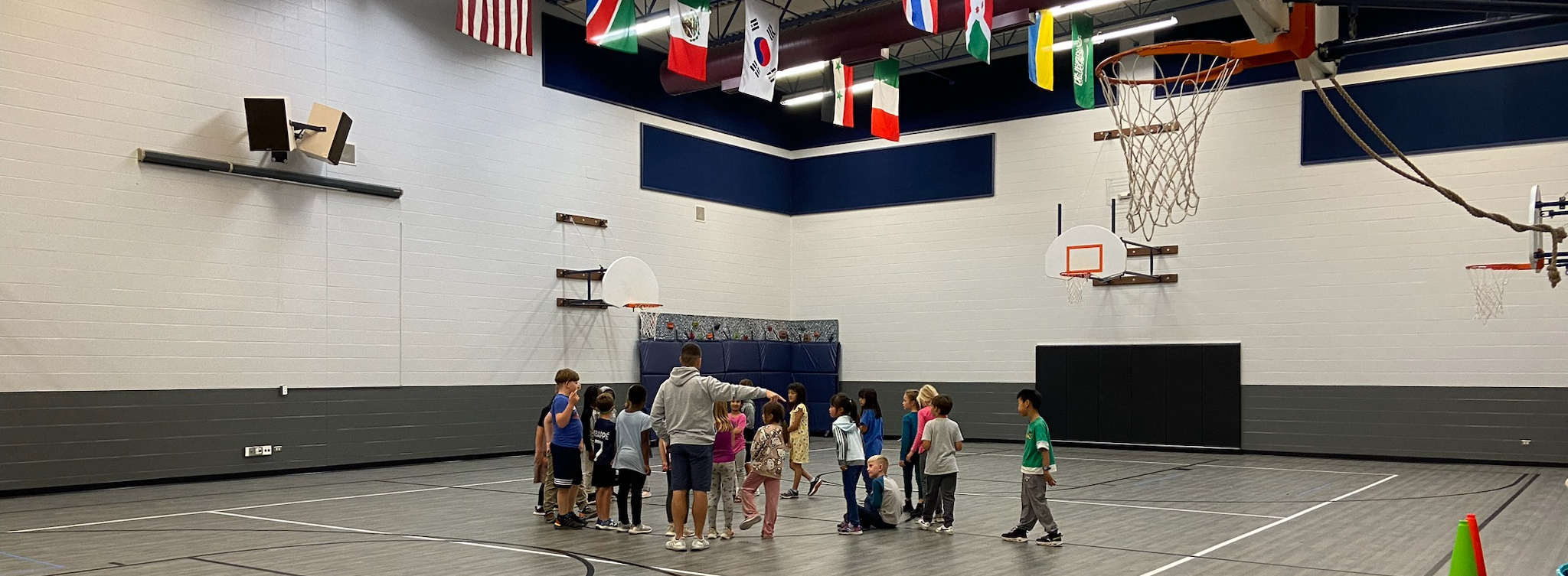 Students listening to instructions in PE from Mr. Bernstein