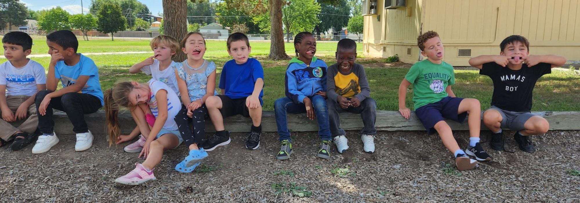 2nd grade boys and girls outside making funny faces