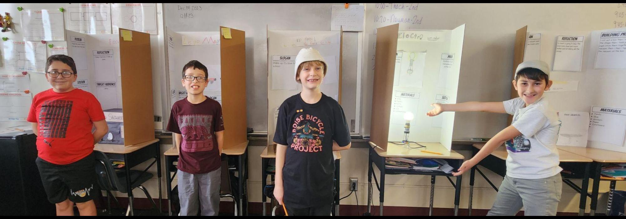 5th grade boys showing off their Invent Idaho Projects