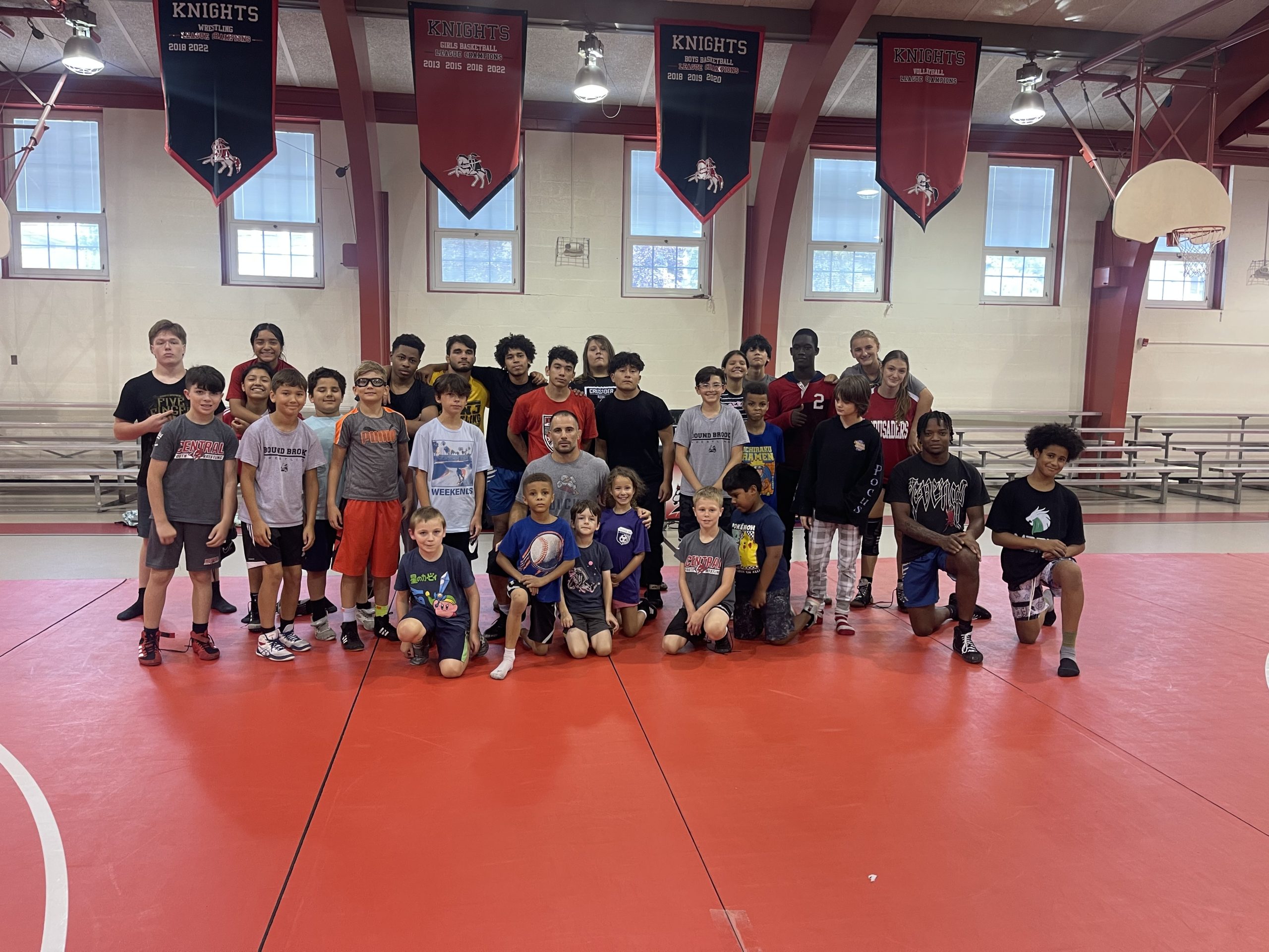 Group pic summer wrestling program Young wrestlers in gym