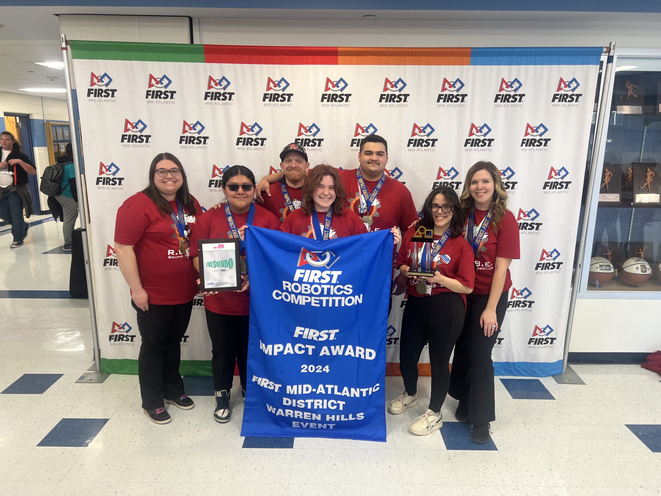 A photo of Team 56 posing with awards