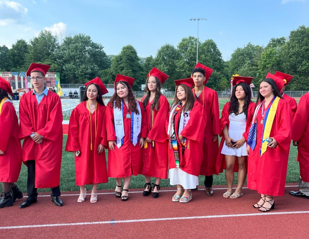 A group of graduates line up for the ceremony and pose for a picture before the event begins.