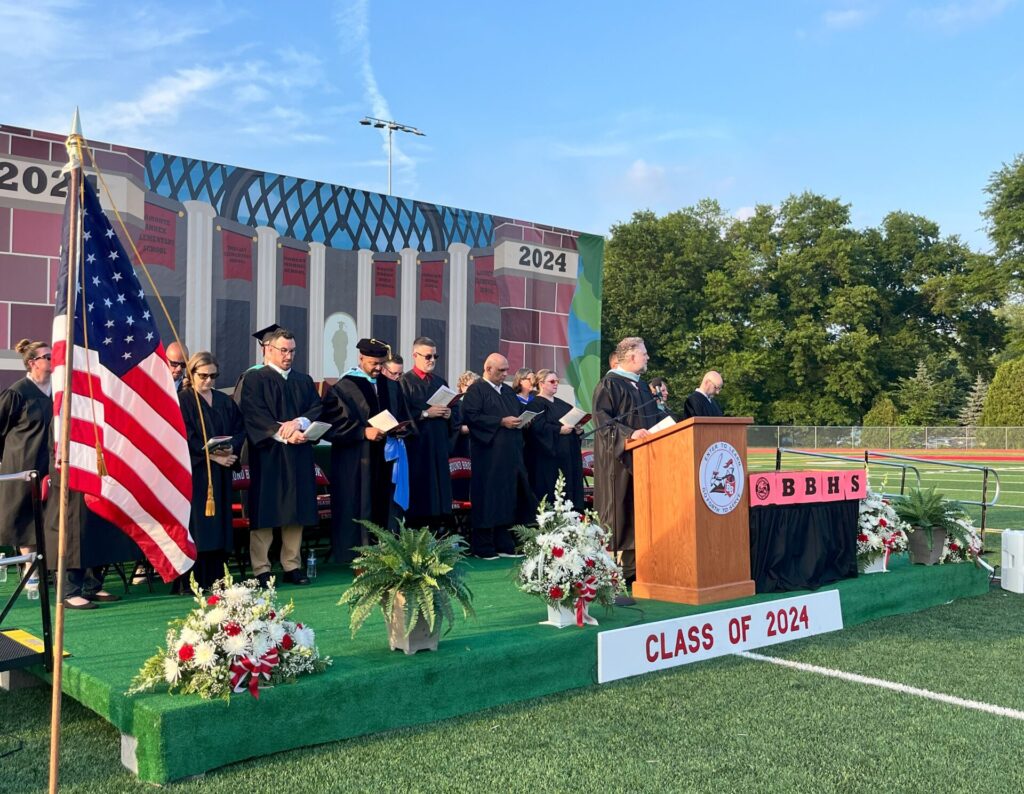 Bound Brook High School Principal Mr. Smith addresses the graduates and audience from the podium.