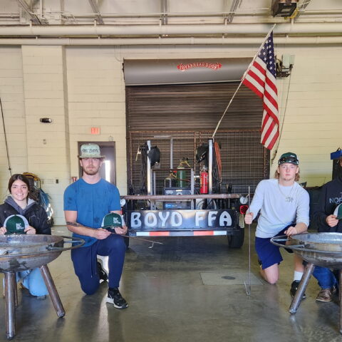 welding students in front of their completed firepits