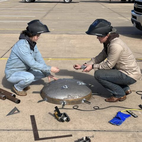 photo of welding students working on a project