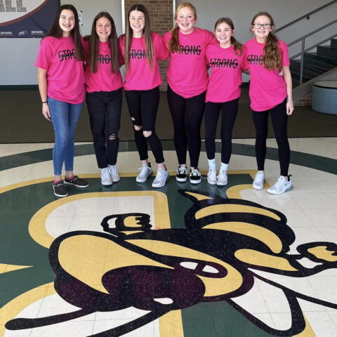 middle school girls in matching pink STRONG shirts