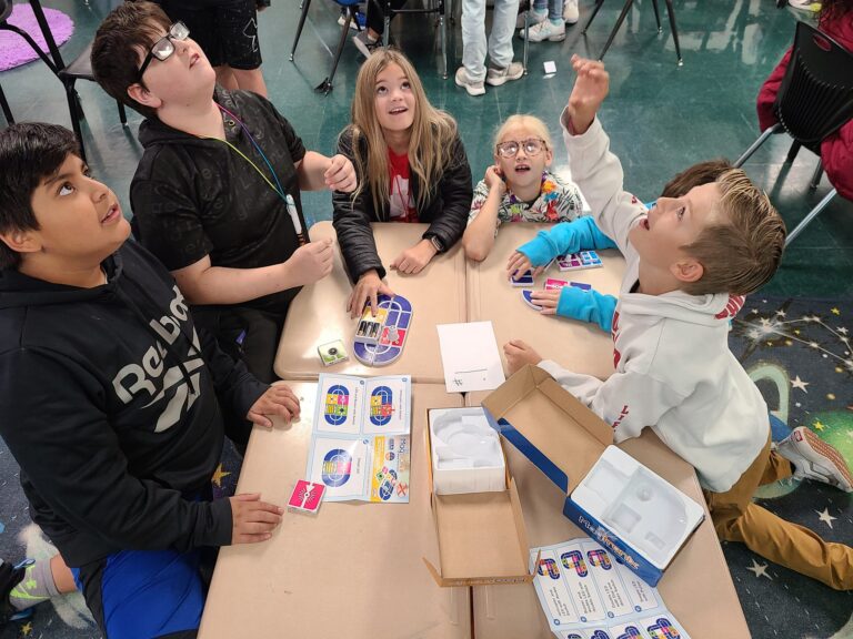 students learning about electricity with flying circuits