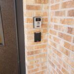 phot of an intercom and card reader at a building entry