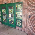 phot of bes front doors with intercom, access control, and obscured views.