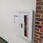 photo of campus fire extinguisher with current inspection