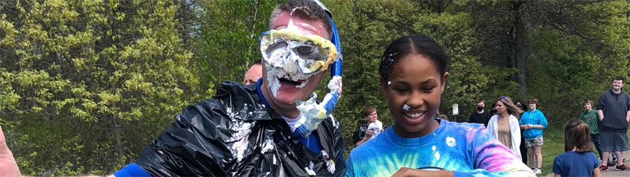 Principal Anderson takes a pie in the face