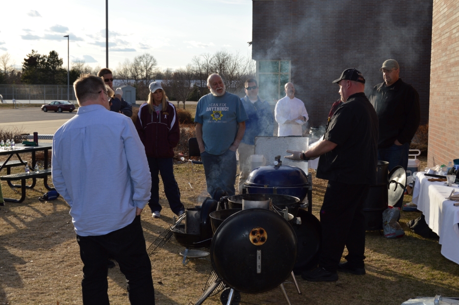 Adults learning to barbeque