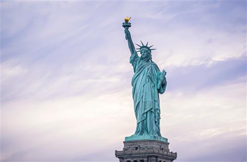 statue of liberty with cloudy background 