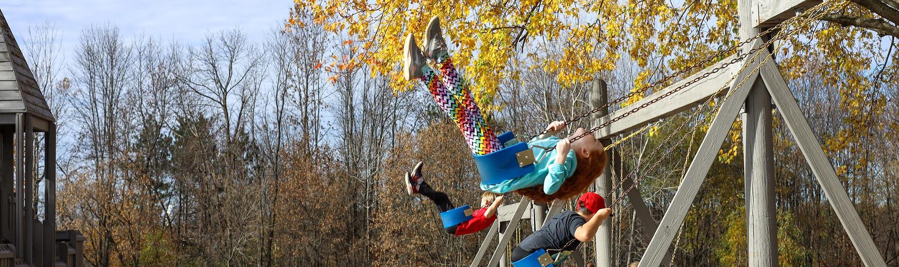 young child on swing