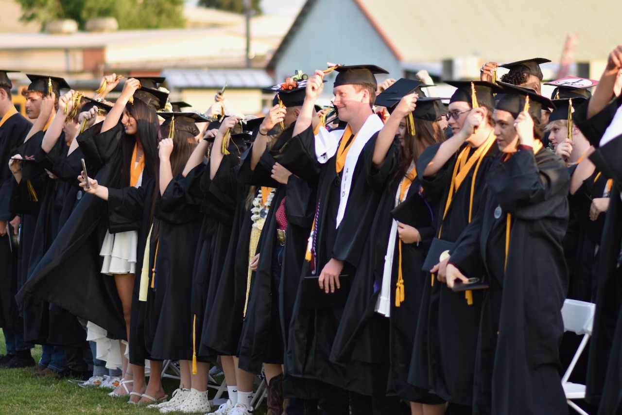 2023 graduates moving their tassles during ceremony