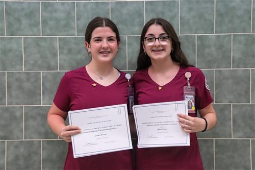  Health Related Occupations students display certificates