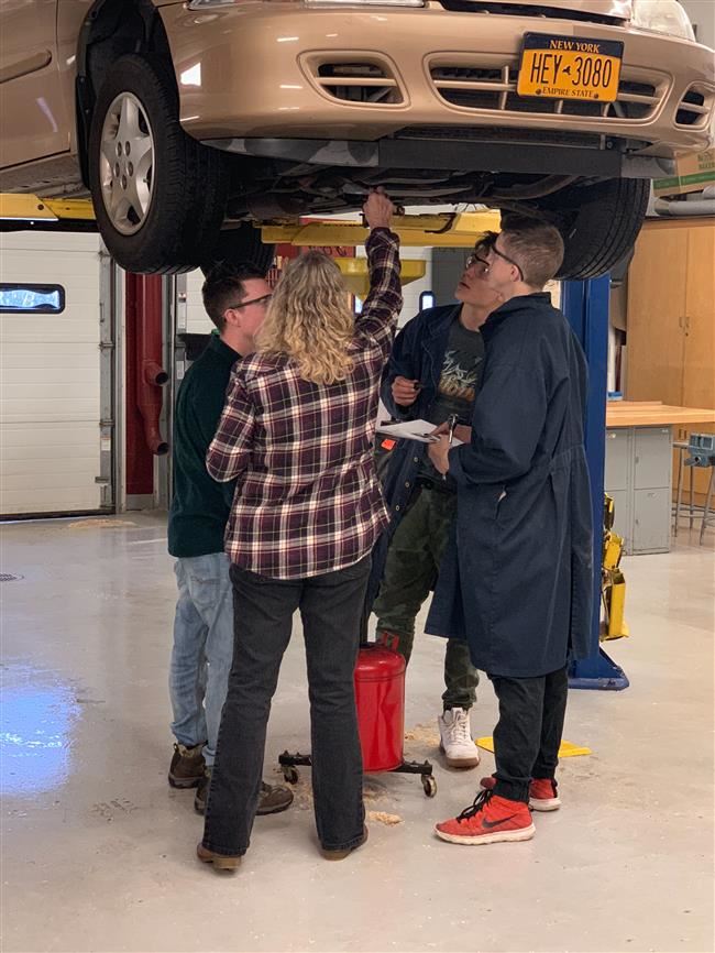 Students working on a car