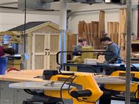 Students working on production machines