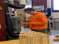 Students working on production machines