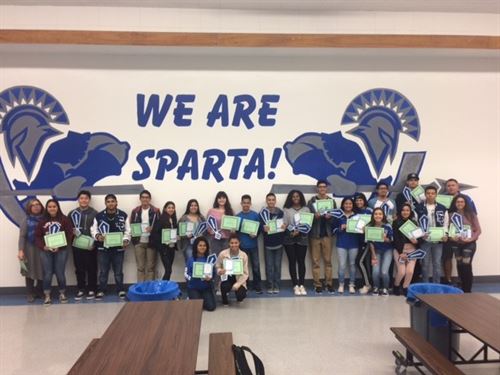 students receiving awards in the cafeteria