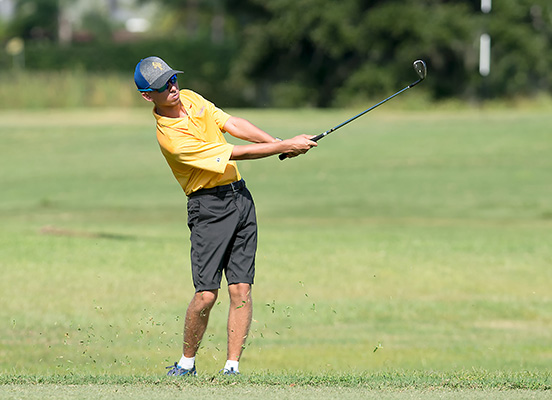 boys golfing action