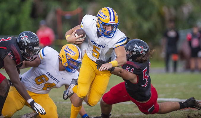 athlete running the football