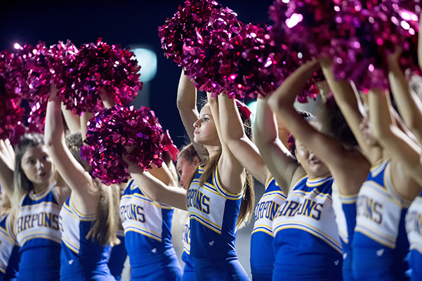 football cheerleaders supporting the team