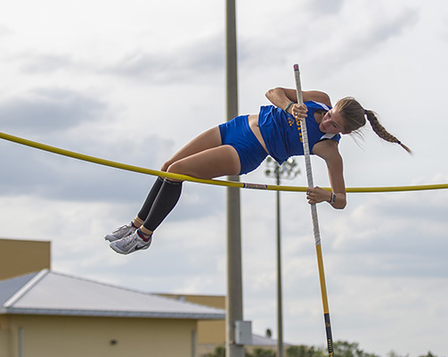 girls high jumper in action