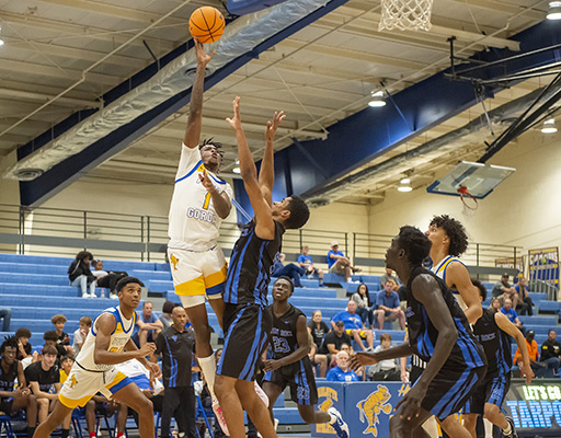 boys basketball player jumping for the ball