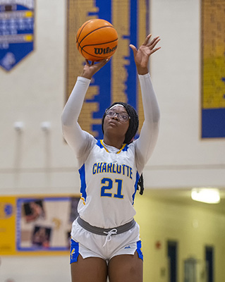 girls basketball player taking the shot