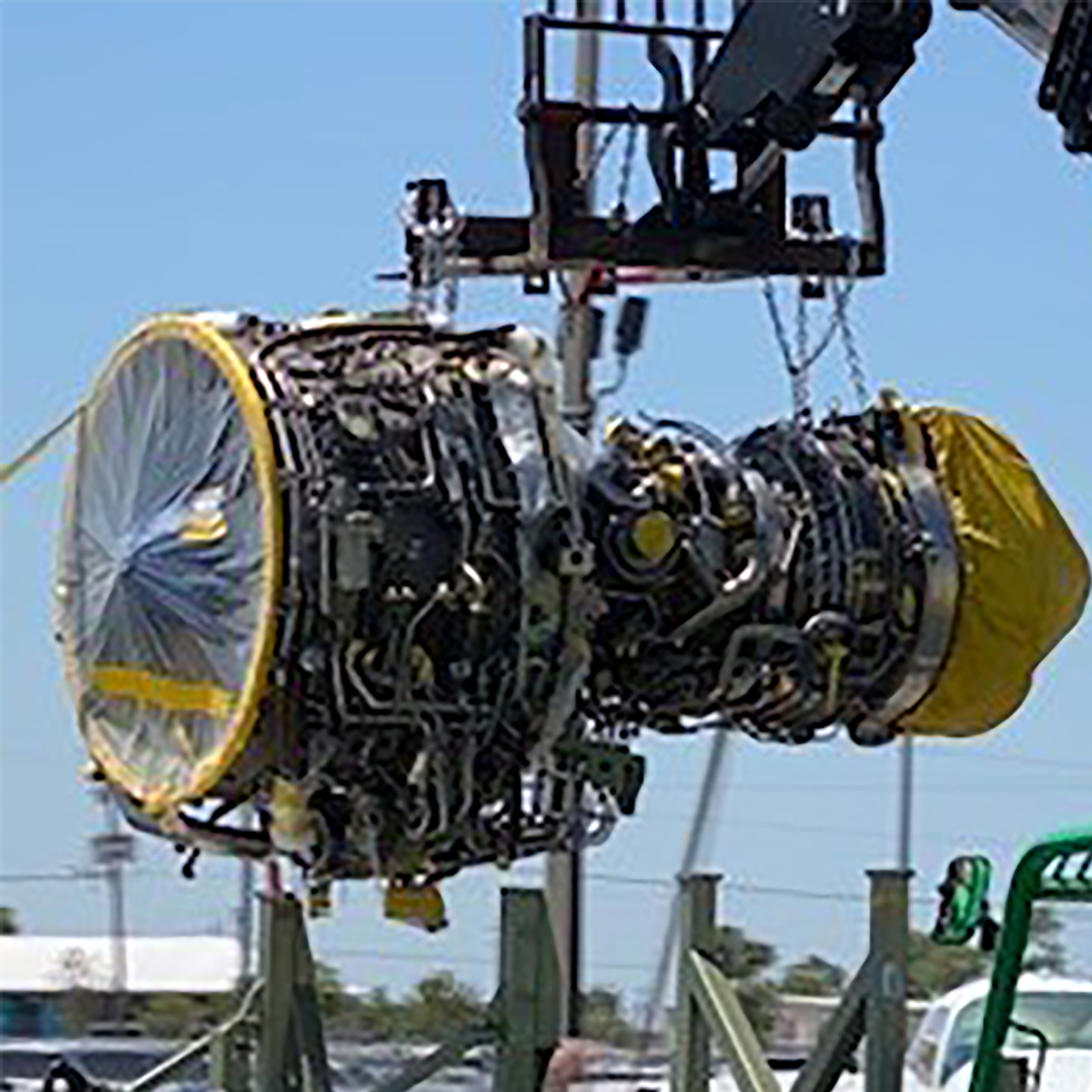 engine being lift by crane