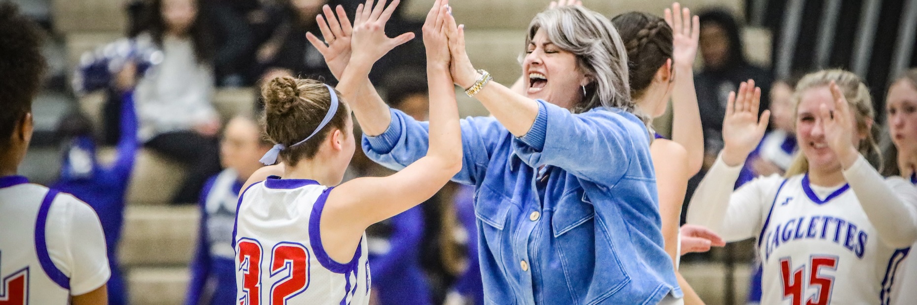 Girls Basketball Coach and Player High Five