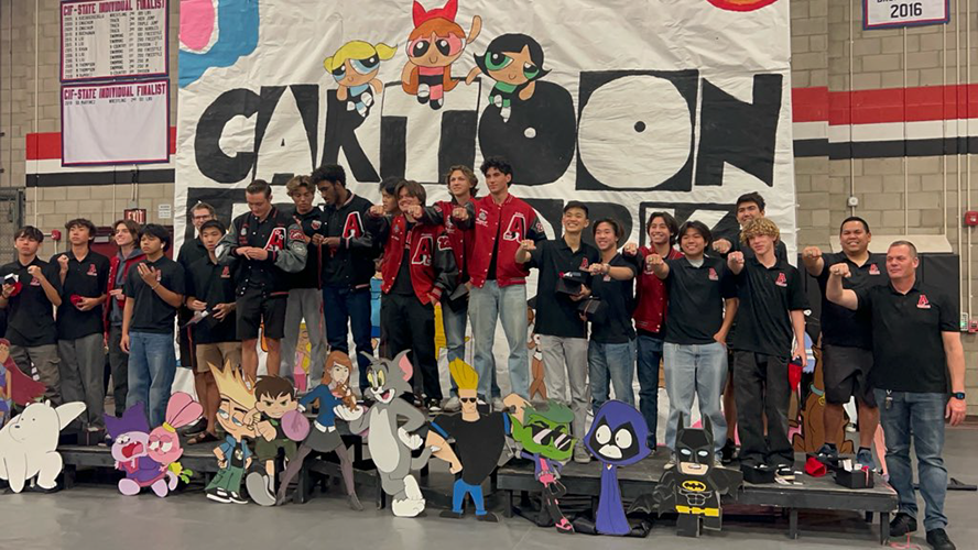 Ayala high boys water polo team showing off their rings