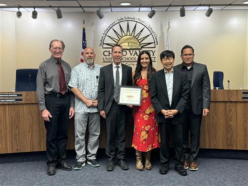 CVUSD Board of Education poses with the Daily Bulletin certificate