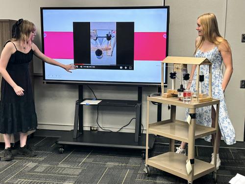 Don Lugo engineering students examining their project