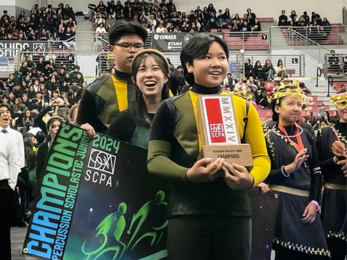 Townsend drumline students holding the award for winning 