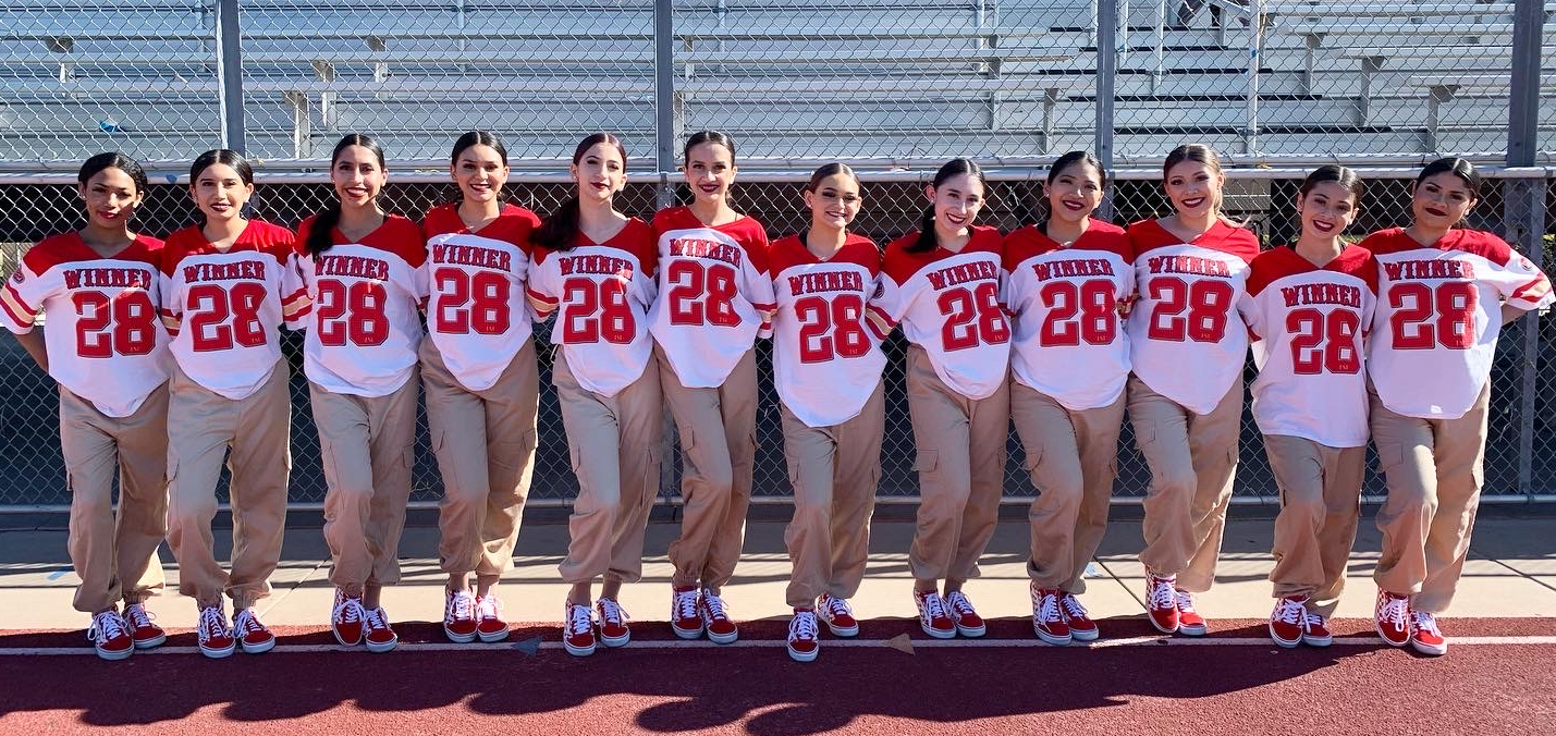 A group of people wearing matching t-shirtsDescription automatically generated with medium confidence
